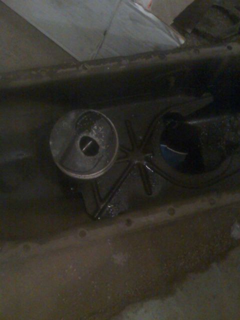 1992 Ford Bronco - Oil pan and filter housing removed from engine for service.