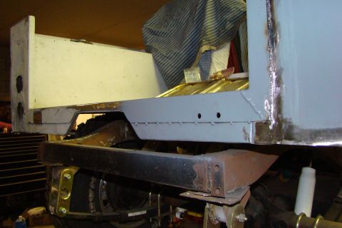 1948 Jeep Wrangler - Repair work on the rear quarter panel and frame of a Jeep CJ-5.