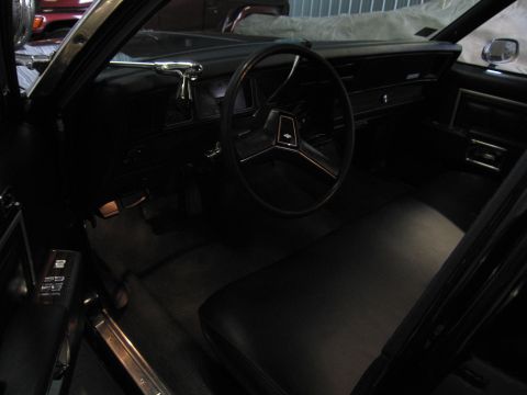 1991 Ford LTD Crown Victoria - Photograph of a classic sedan's interior with steering wheel and dashboard, not a technical document.
