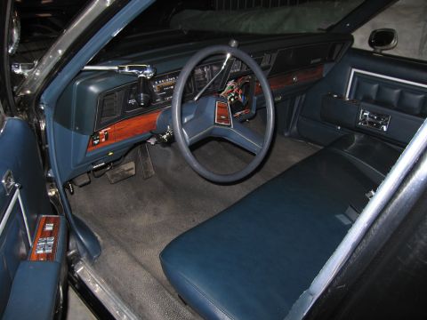 1991 Ford LTD Crown Victoria - Photograph of a classic sedan's blue interior and dashboard, not a technical document.