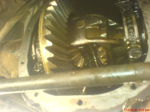 1992 Ford Crown Victoria - A close-up view of the internal gears of a vehicle's differential, showing the ring gear and pinion. The components appear to be lubricated…