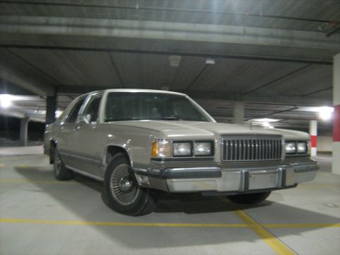 1988 Mercury Grand Marquis - A 1988 Mercury Grand Marquis is shown parked in a dimly lit parking garage.