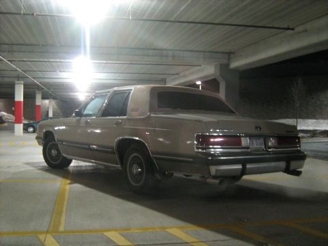 1988 Mercury Grand Marquis - Rear view of a 1988 Mercury Grand Marquis in a dimly lit parking garage.