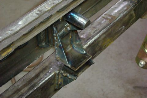 1948 Jeep Wrangler - Detail of a metal frame, likely part of a vehicle chassis, showing welded joints and construction.
