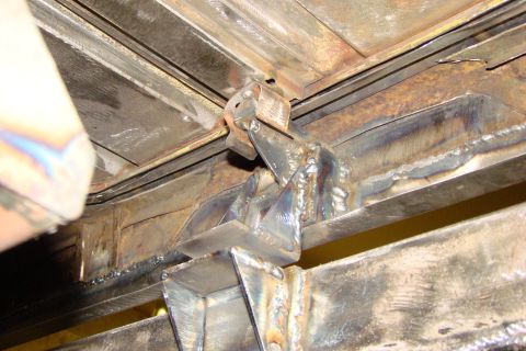 1948 Jeep Wrangler - Close-up of a welded metal frame section, possibly part of a vehicle's undercarriage, with a Supermotors.net watermark.
