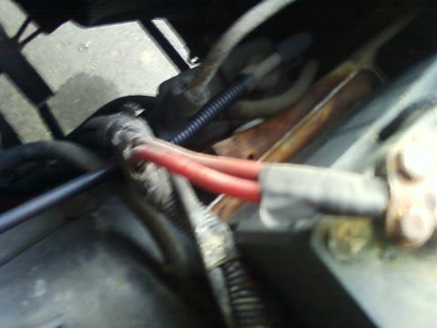 1996 Ford Bronco - Engine bay wiring detail with red cables and protective tubing.