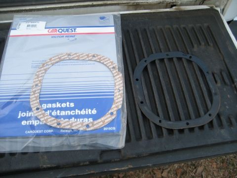 2004 Ford F-150 - Carquest Victor Reinz gaskets package and a rubber seal are shown on a truck bed.