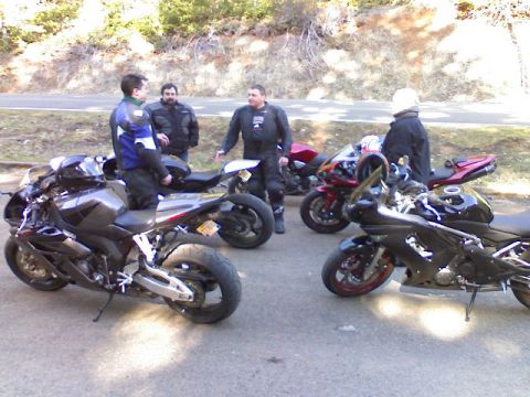 2008 Kawasaki Ninja R - A group of riders and their motorcycles gathered outdoors.