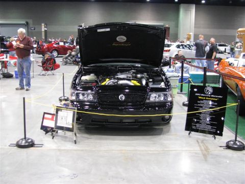 2003 Mercury Marauder - A black 2003 Mercury Marauder is displayed with its hood open at a car show.