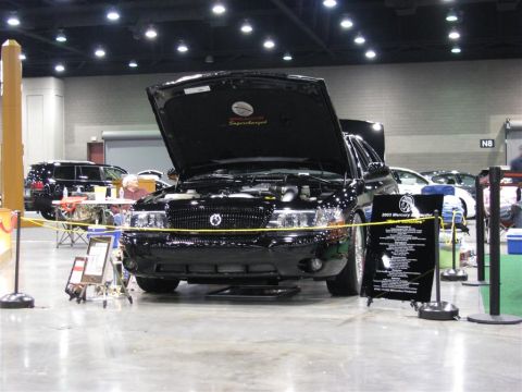 2003 Mercury Marauder - A black 2003 Mercury Marauder is displayed with its hood open at an indoor event.