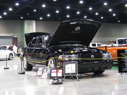 2003 Mercury Marauder - A black 2003 Mercury Marauder is displayed with its hood open at a car show.