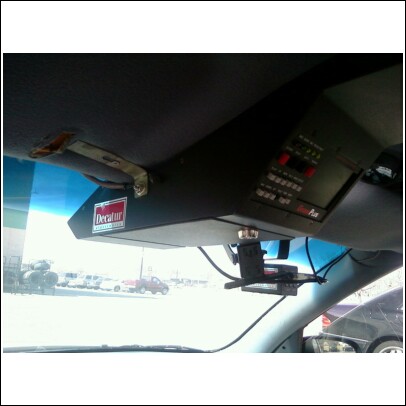 2000 Mercury Grand Marquis - Overhead console with buttons and a Decatur sticker is visible inside a vehicle.