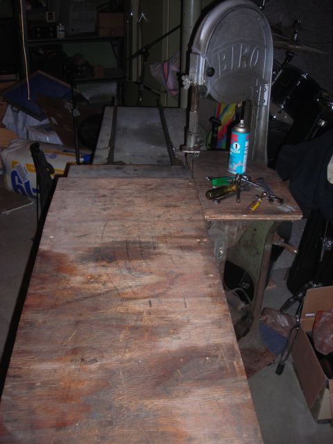 1995 Ford Bronco - A workshop scene a band saw and various tools on a workbench.