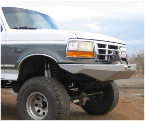 1996 Ford Bronco - This lifted Ford F-150 features a custom front bumper with an integrated winch, ready for off-road adventures.