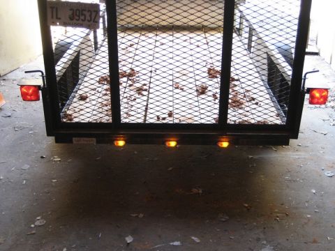 2004 Ford F-150 - Rear view of a trailer with a license plate and lights.