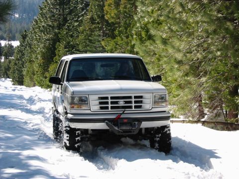 1996 Ford Bronco - This 1996 Ford Bronco navigates a snowy trail, equipped with a front winch.
