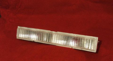 1989 Ford Bronco II - Clear plastic marker light with ribbed interior, likely for an older vehicle.