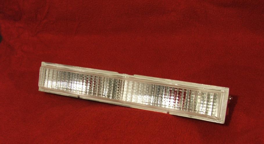clear plastic automotive marker light with ribbed interior