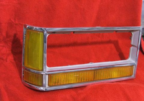 1989 Ford Bronco II - This chrome-trimmed tail light assembly features amber lenses and appears to be a replacement part.