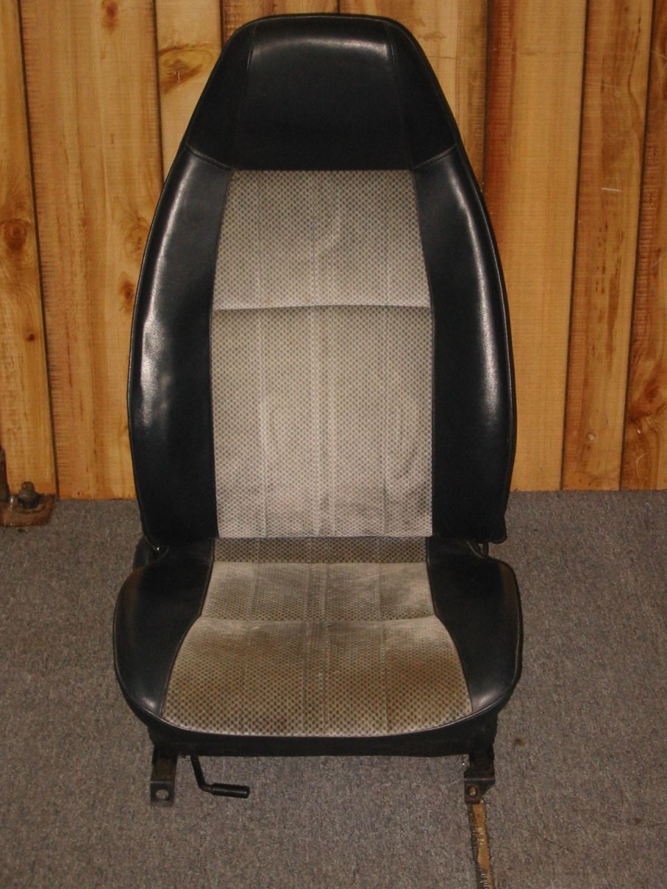 Front view of a black and grey fabric car seat.