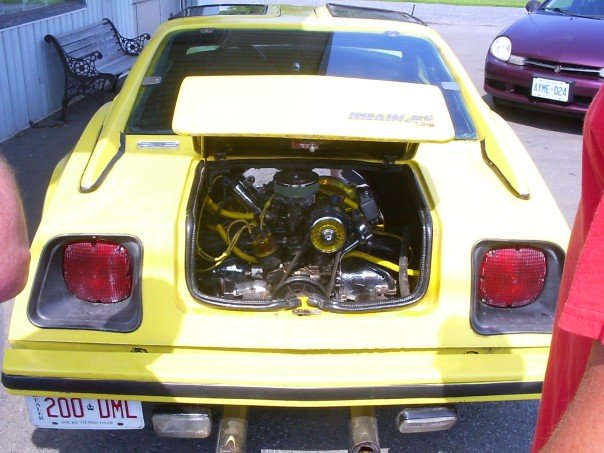 Yellow kit car from rear with open engine bay showing air-cooled engine