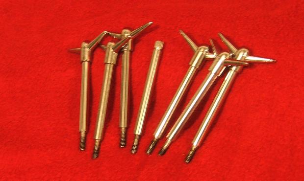 Group of metal tools on a red surface