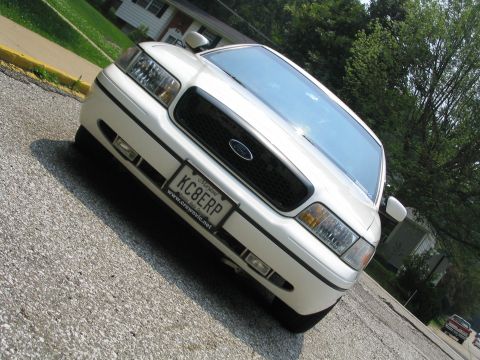 1998 Ford Crown Victoria - Front view of a white 1998 Ford Crown Victoria parked on a street.