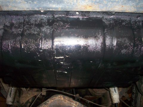 1978 Jeep CJ5 - Underbody view shows a fuel tank and suspension components, including two shock absorbers.