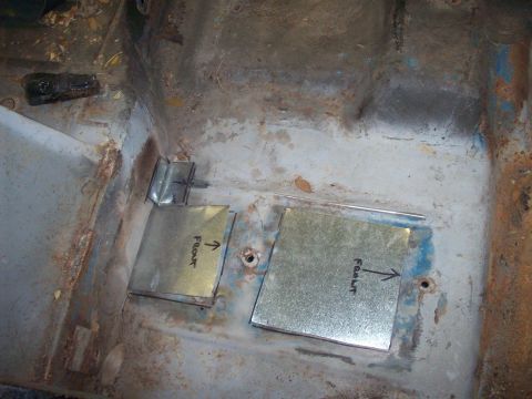 1978 Jeep CJ5 - Close-up of a vehicle's interior floor pan showing rust and two newly installed metal patches.