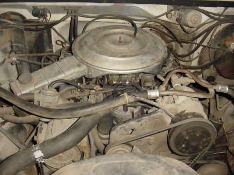 1982 Ford Bronco - Close-up view of a vehicle's engine bay, showing various components and wiring.