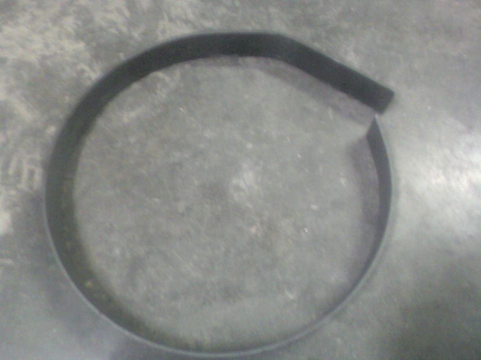 Black rubber seal on gray concrete