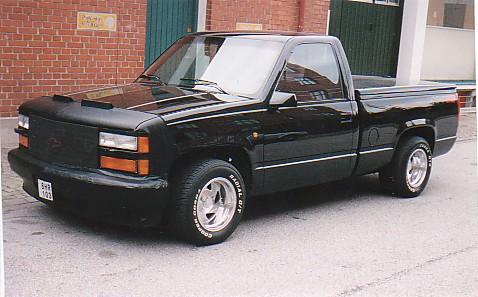 1998 Ford Crown Victoria - This black pickup truck is shown from a 3/4 front angle. The license plate reads BHR 103.