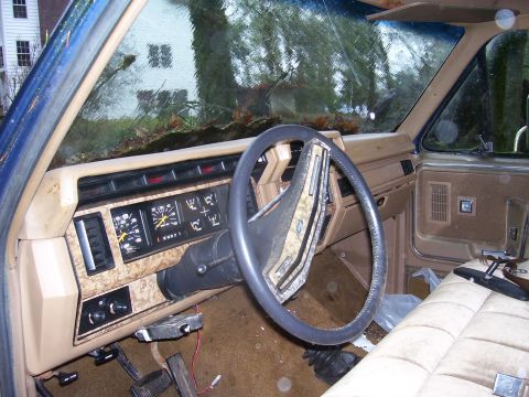 1991 Ford Bronco - Dashboard and interior of an older model truck, possibly from the 1980s.
