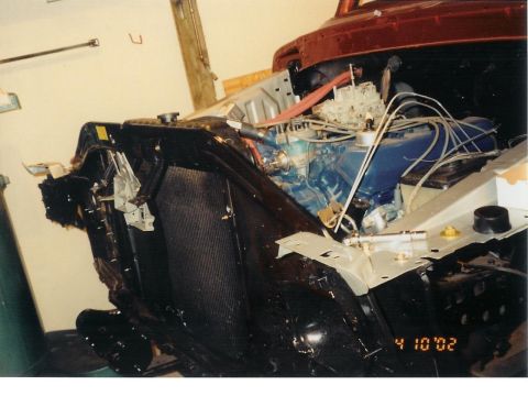 1978 Ford Bronco - Close-up of a vehicle's engine bay, showing the engine, radiator, and carburetor, with a date stamp.