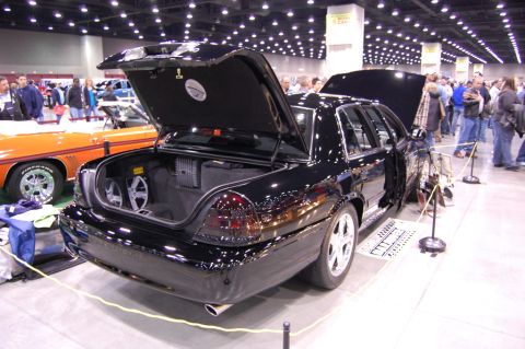2003 Mercury Marauder - A black 2003 Mercury Marauder is displayed with its trunk open, revealing a custom audio system.