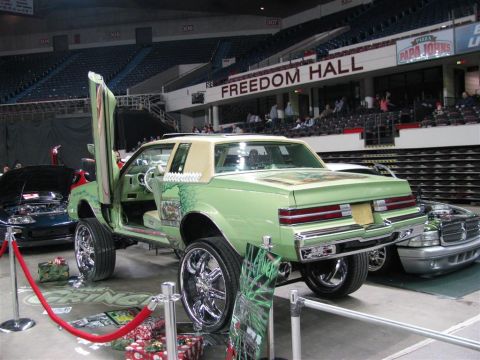 2003 Mercury Marauder - Customized coupe with gullwing doors on display at an auto show.