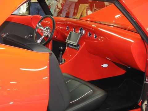 2003 Mercury Marauder - Custom interior of a show car with a vibrant orange dashboard and black seats.