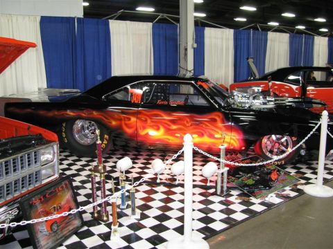 2003 Mercury Marauder - Custom drag car with flame paint and trophies on display at a car show.