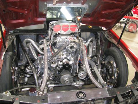 2003 Mercury Marauder - Engine bay of a custom car, a supercharged V8 with chrome components.