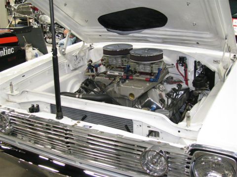 2003 Mercury Marauder - Custom V8 engine with dual carburetors and chrome accents.