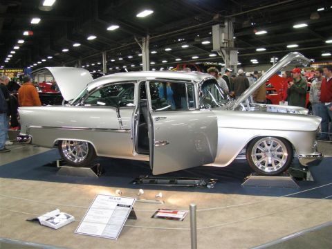 2003 Mercury Marauder - Silver 1955 Chevrolet Bel Air on display at a car show, doors and hood open.
