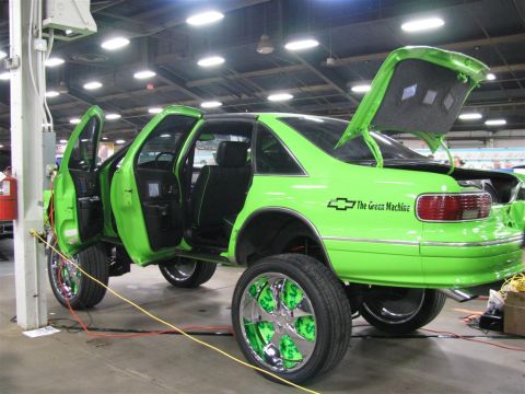 2003 Mercury Marauder - A heavily customized Chevrolet Caprice, nicknamed "The Green Machine", is displayed with its doors and trunk open.