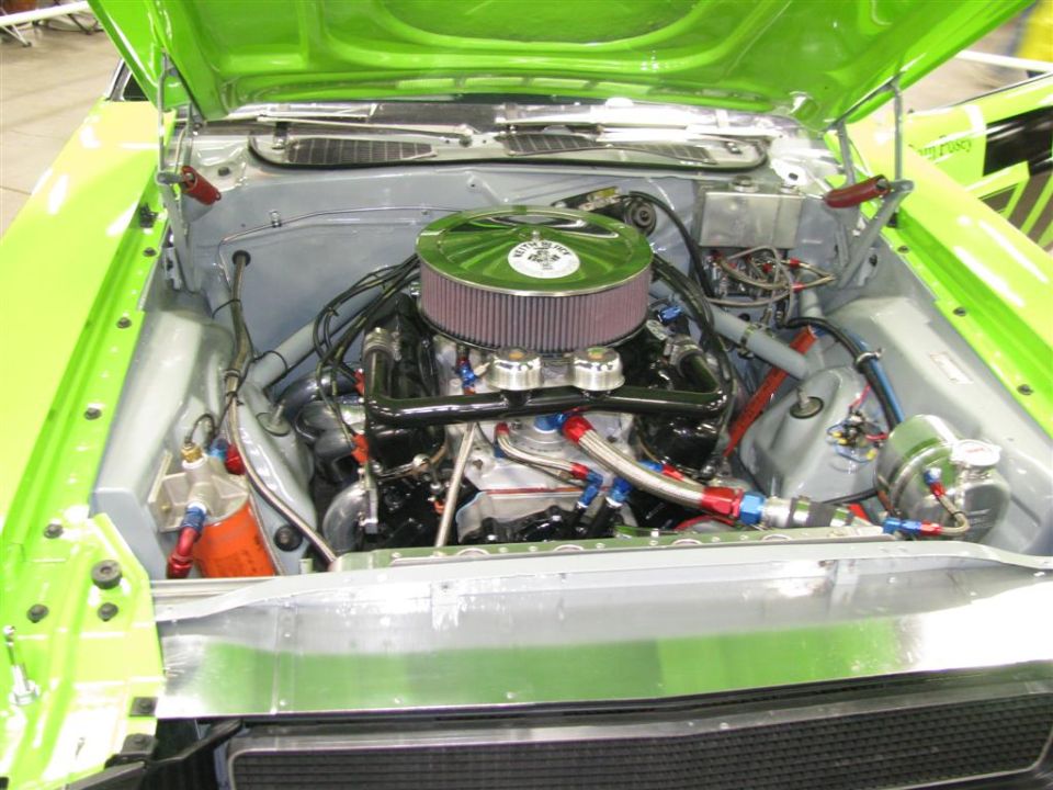 Engine bay with custom air intake, braided hoses, and polished components