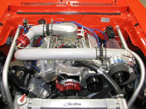 2003 Mercury Marauder - Close-up of a highly modified V8 engine, a prominent supercharger and custom intake plumbing.