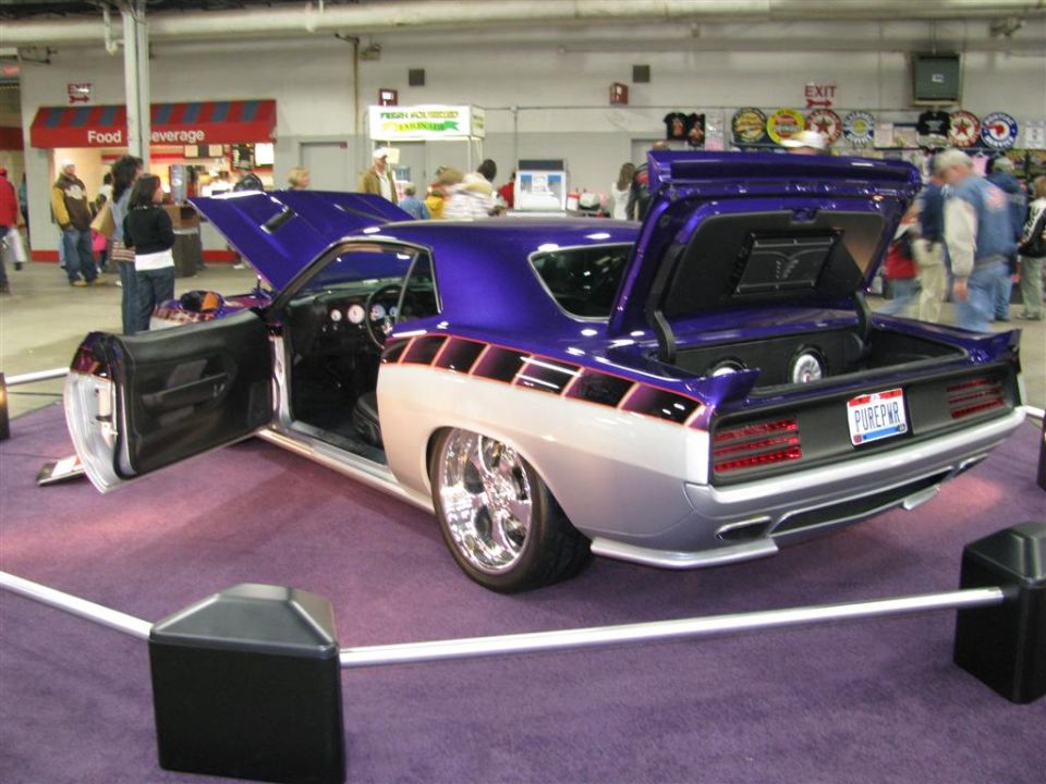 Custom purple and silver coupe, doors and trunk open, showing interior and trunk audio system