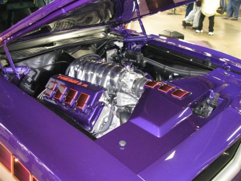 2003 Mercury Marauder - A highly customized engine bay with a HEMI 6.1 engine is showcased under the hood of a purple vehicle.