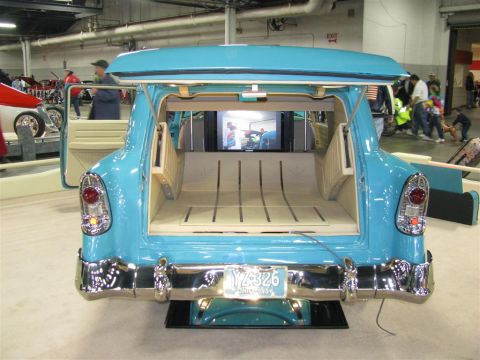 2003 Mercury Marauder - Customized blue station wagon from 1956 features a unique interior with a television screen visible in the cargo area.