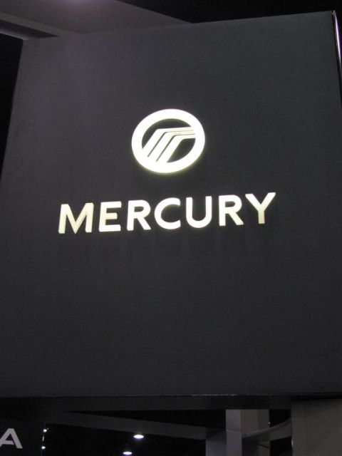 2003 Mercury Marauder - Illuminated Mercury logo and text displayed on a black background.