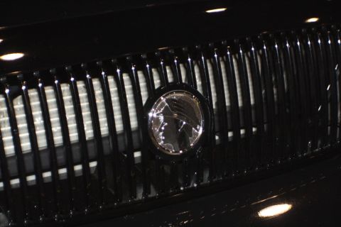 2003 Mercury Marauder - Close-up of the distinctive Mercury emblem on the grille of a 2003 Mercury Marauder.