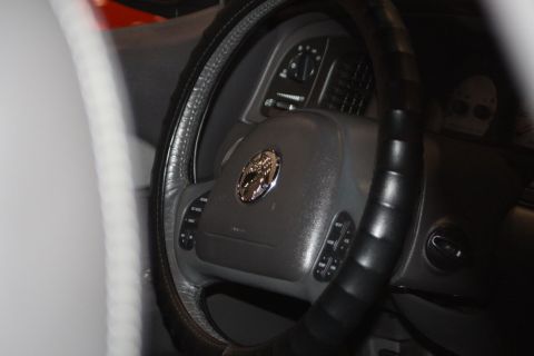 2003 Mercury Marauder - Close-up of a car's interior, focusing on the steering wheel and instrument panel.